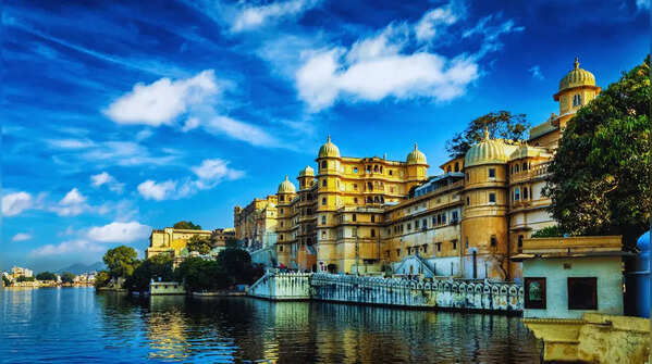 A stunning white palace seemingly floats on tranquil waters.