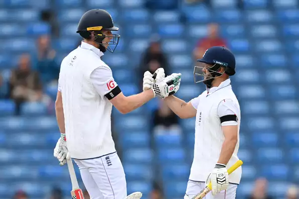 England's openers celebrate a successful partnership.