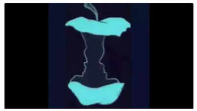 Optical illusion featuring an apple and two faces