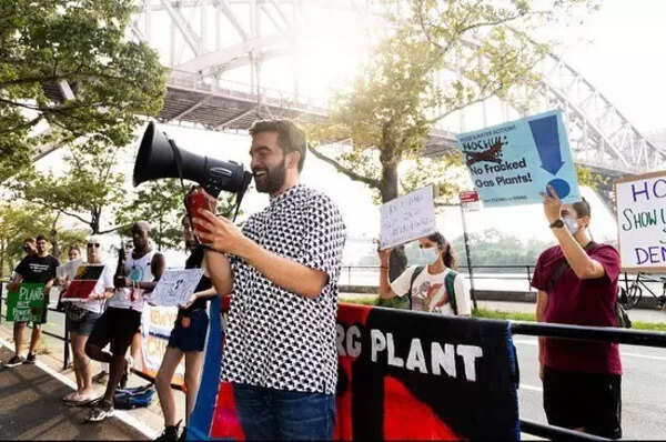 Mamdani advocates against gas plant in a smart casual outfit.